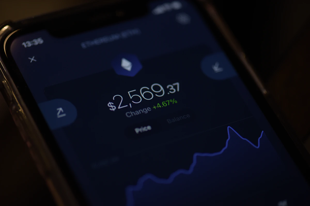 A phone showing a crypto price and chart